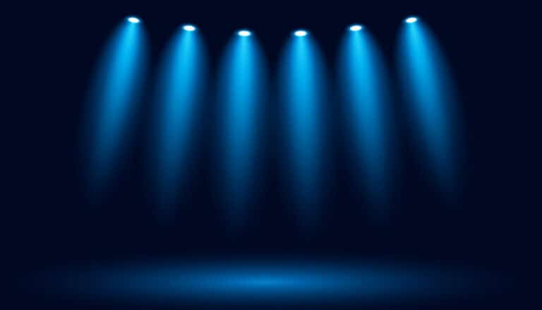Glowing spotlights on a dark blue background. Vector backdrop illustration